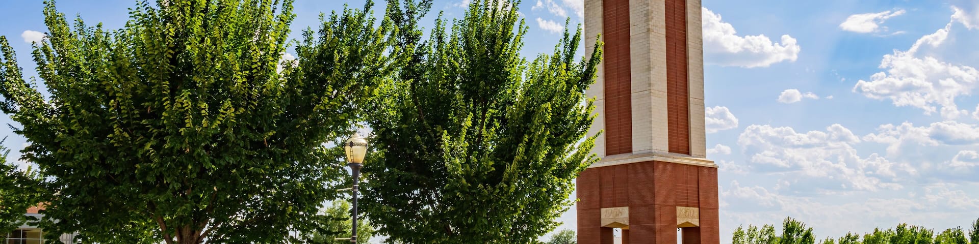 Sunny view of the Freede Centennial Tower of Oklahoma Christian University