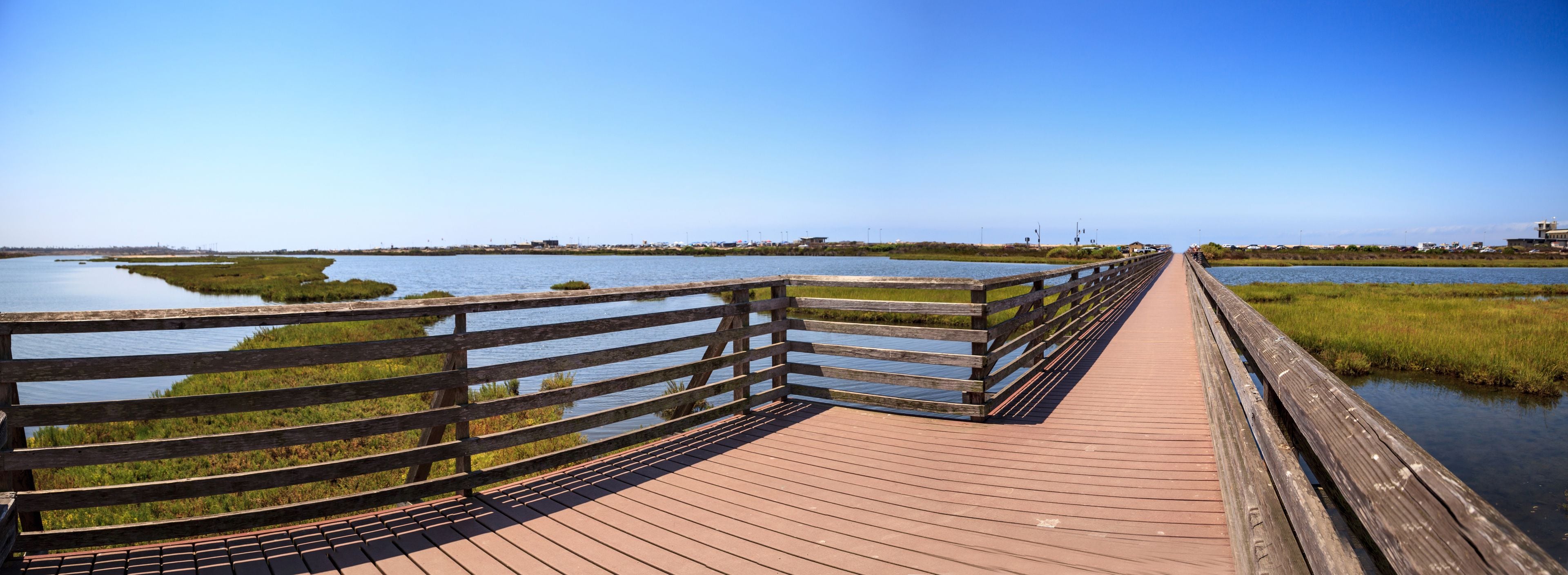 Bridge along the peaceful and tranquil marsh of Bolsa Chica wetlands