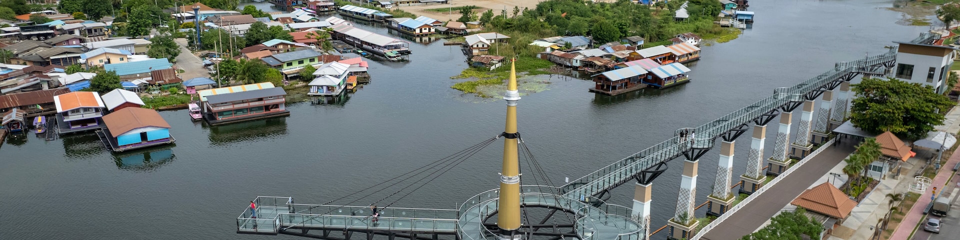 Aerial view of Skywalk Observation Deck made by transparent glass with beautiful Kanchanaburi city view by river at Kanchanaburi province Thailand.