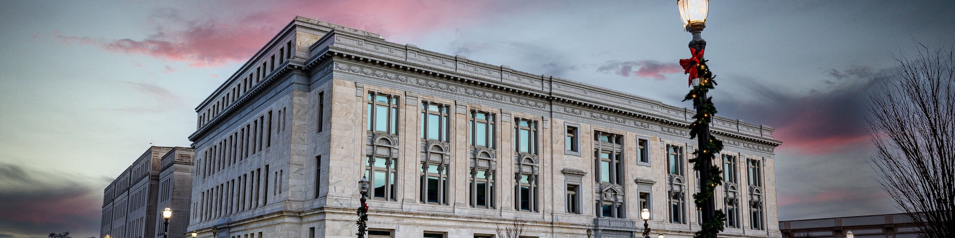 The Madison County Courthouse in Edwardsville, Illinois, during the early morning hours, with streetlights still glowing.
