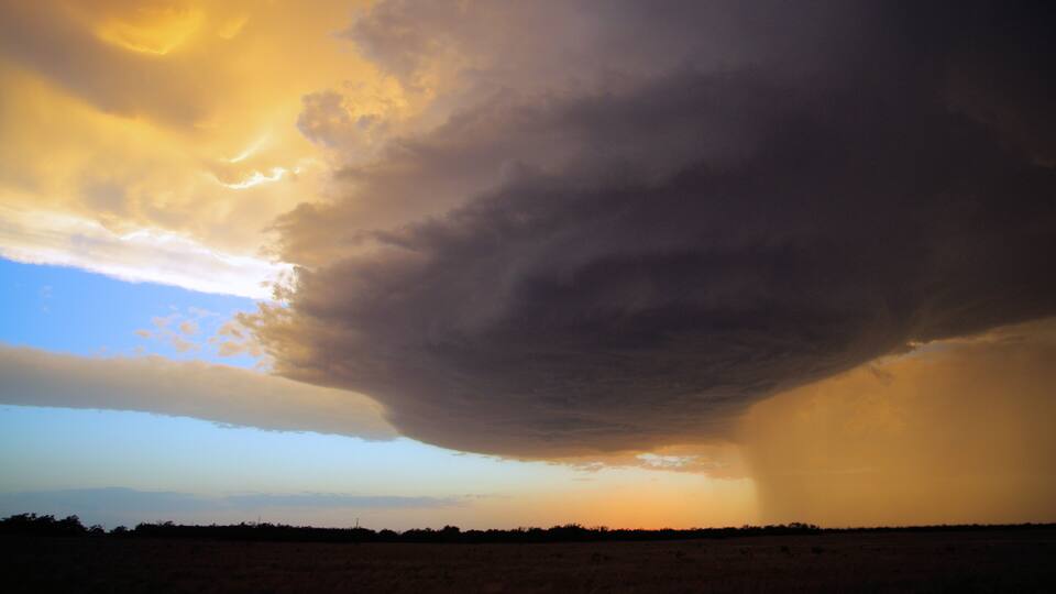 A storm cloud over a flat landscape.