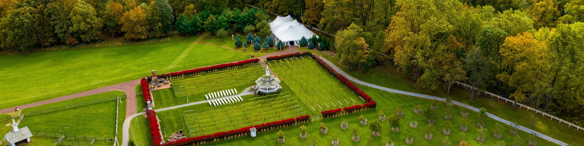 Elizabethtown, Pennsylvania, October 22, 2023 - An Aerial View of a Large Gazebo in the Middle of a Vineyard, With Seating for a Weddings on an Autumn