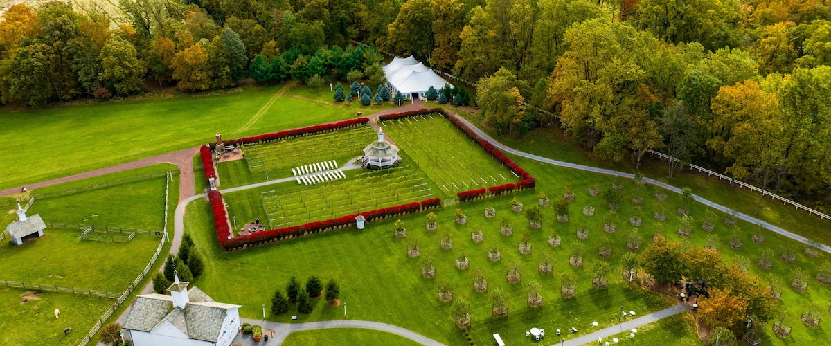 Elizabethtown, Pennsylvania, October 22, 2023 - An Aerial View of a Large Gazebo in the Middle of a Vineyard, With Seating for a Weddings on an Autumn