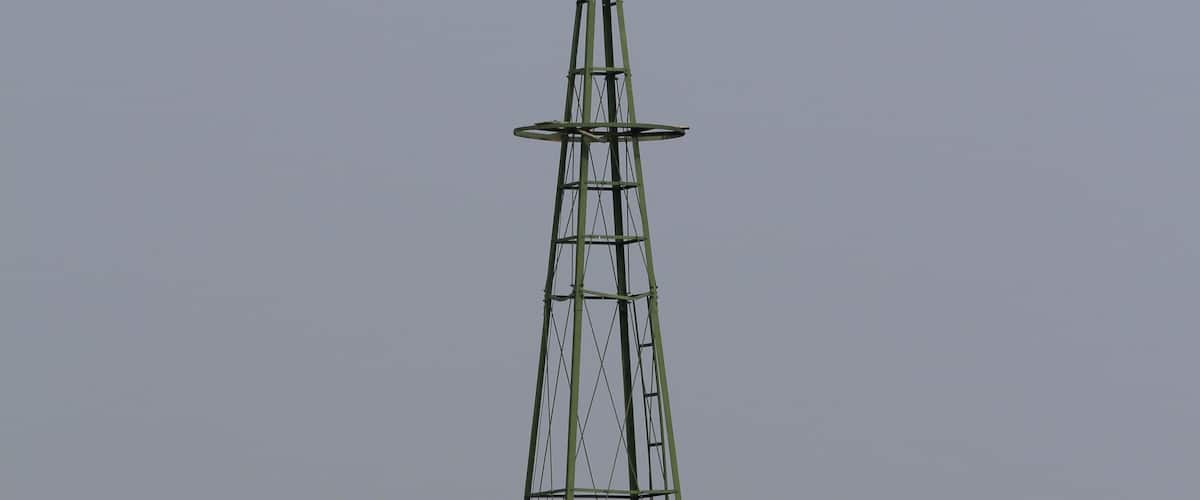 A windmill in a field.