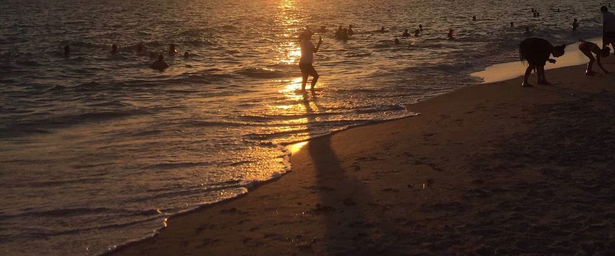 Warm, full of life and beautiful people. Ended our day listening to the drum circle surrounded by kids and familie's