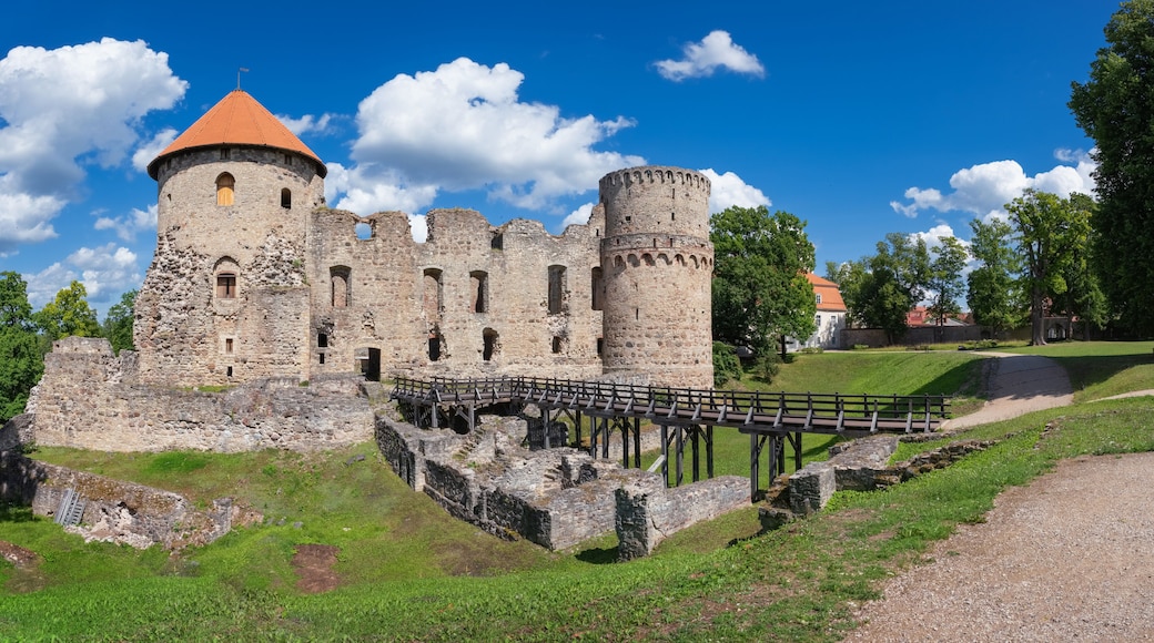 Latvian tourist landmark attraction - ruins of the medieval Livonian castle, stone walls and towers in old Cesis town, Latvia.