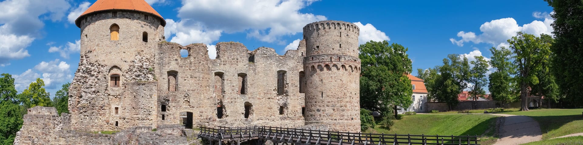 Latvian tourist landmark attraction - ruins of the medieval Livonian castle, stone walls and towers in old Cesis town, Latvia.