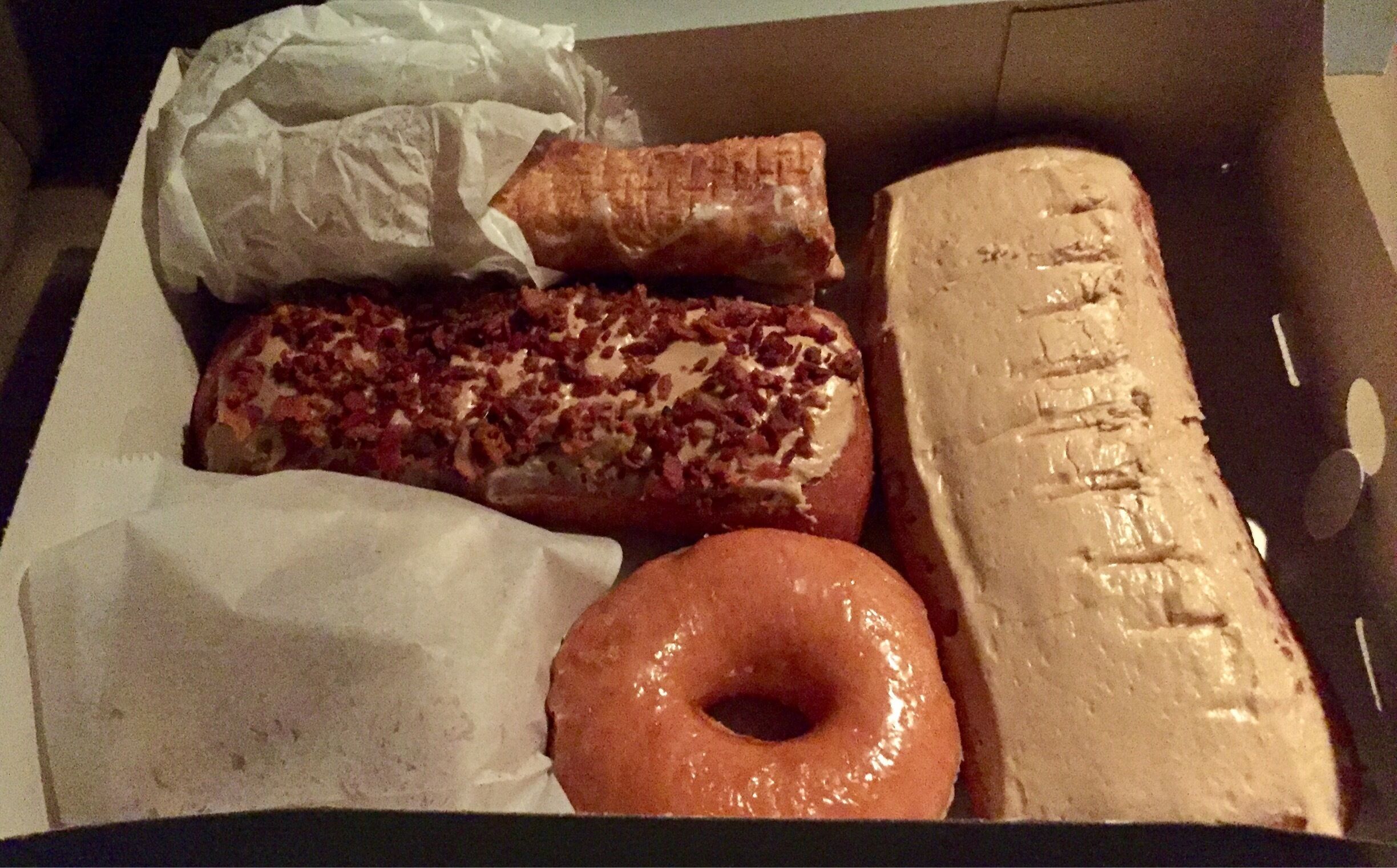 #foodiefinds The take home from my previous picture. Maple Bar, Bacon Maple Bar, old Fashioned, donut holes and cream filled roll. 