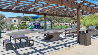 Covered gathering area in community park with picnic tables, Escondido, San Diego, California