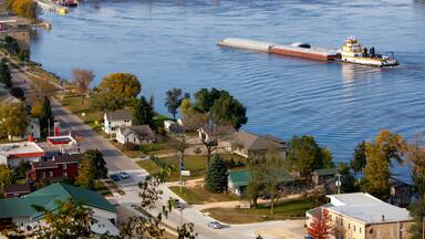 BTHW55 Heading for the lock at Bellevue, Iowa, a barge heads up the Mississippi River.