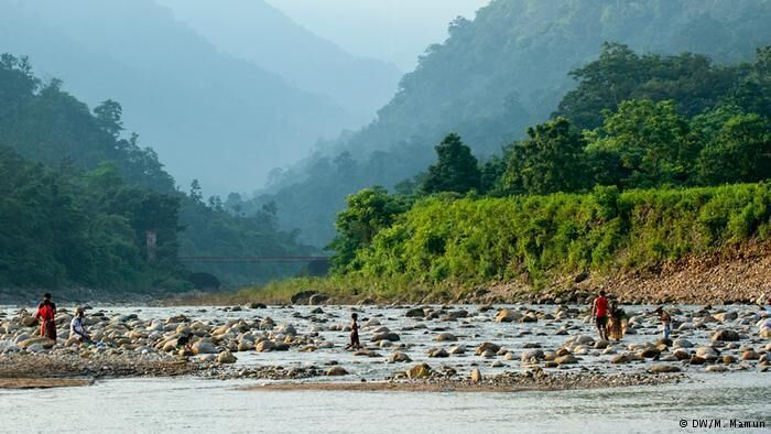 Bisnakandi is a village situated in Rustompur Union under Guainghat Upazilla. This is where many layers of the Khasi mountain meet at a single point from both sides. Flowing from above is a high fall. Adding to its charm are dark clouds hugging the mountain in the rainy season. And flowing underneath towards Bholaganj is a branch of the Piyain. Along the stream flowing from high up in the mountain come huge boulders that are deposited and mined in Bisnakandi.

http://www.visitsylhet.com/places-to-visit/bisnakandi
