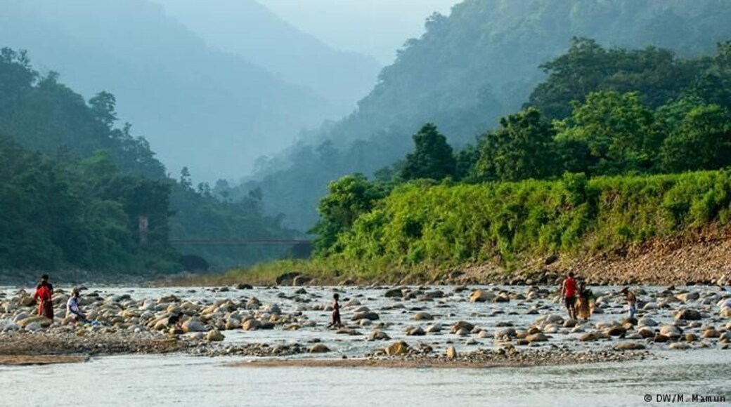 Bisnakandi is a village situated in Rustompur Union under Guainghat Upazilla. This is where many layers of the Khasi mountain meet at a single point from both sides. Flowing from above is a high fall. Adding to its charm are dark clouds hugging the mountain in the rainy season. And flowing underneath towards Bholaganj is a branch of the Piyain. Along the stream flowing from high up in the mountain come huge boulders that are deposited and mined in Bisnakandi.
http://www.visitsylhet.com/places-to-visit/bisnakandi