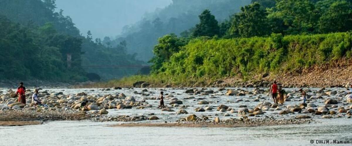 Bisnakandi is a village situated in Rustompur Union under Guainghat Upazilla. This is where many layers of the Khasi mountain meet at a single point from both sides. Flowing from above is a high fall. Adding to its charm are dark clouds hugging the mountain in the rainy season. And flowing underneath towards Bholaganj is a branch of the Piyain. Along the stream flowing from high up in the mountain come huge boulders that are deposited and mined in Bisnakandi.
http://www.visitsylhet.com/places-to-visit/bisnakandi