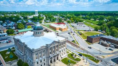 Aerial View of Historic Courthouse in Small Town with Greenery
