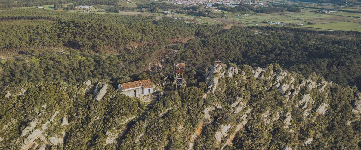 Aerial view of scenic Monte de Sao Bartolomeu with lush forest and tranquil valley, Nazare, Leiria, Portugal.