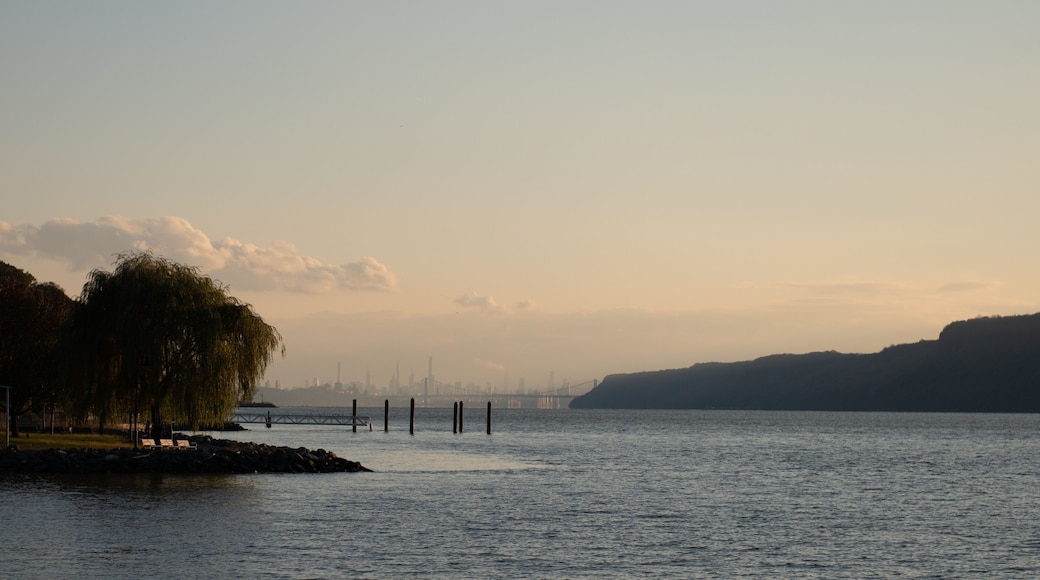 The New York City skyline, George Washington Bridge, and the Hudson River as seen from Dobbs Ferry, New York, USA in November.
