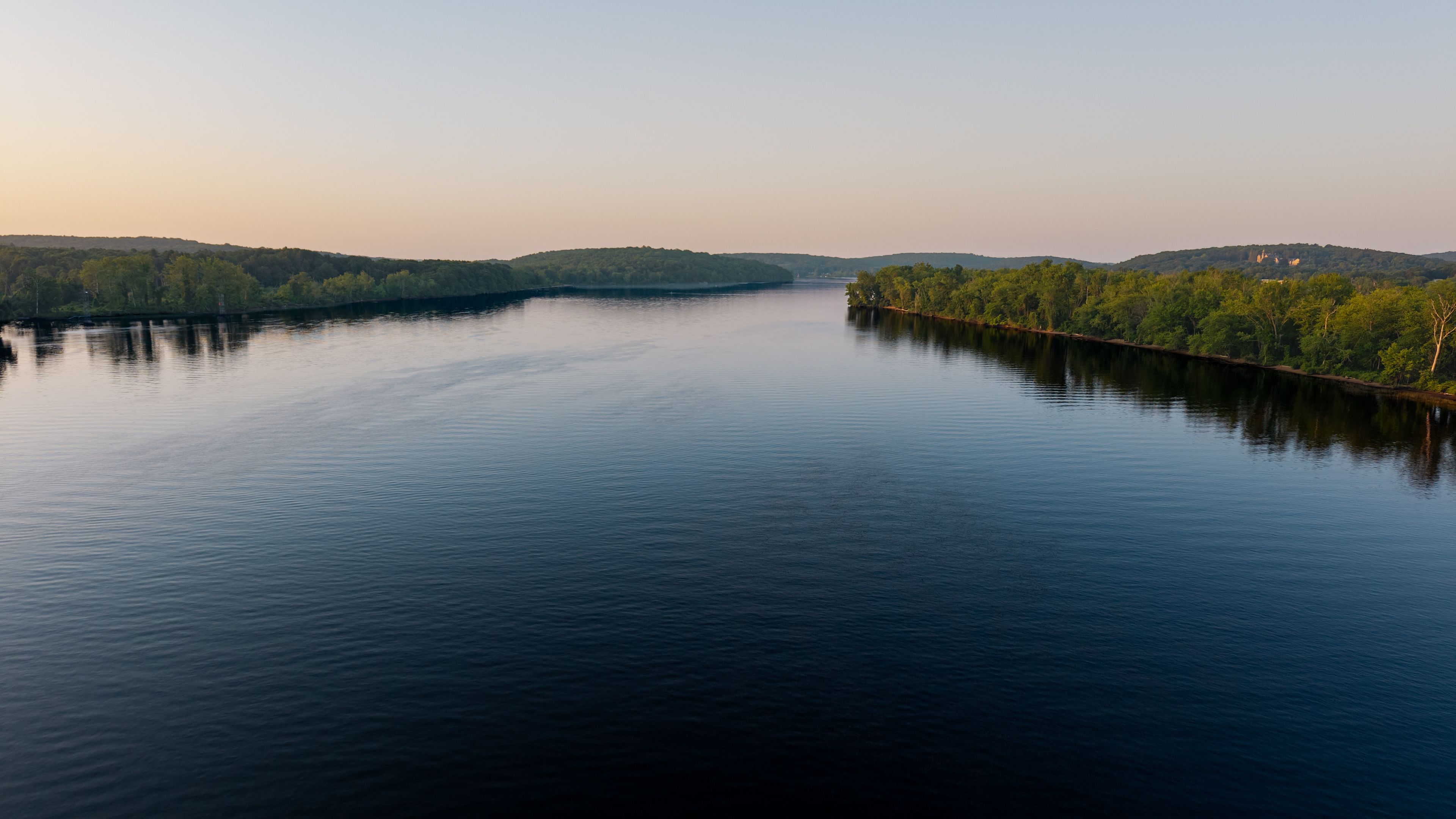Summer aerial view featuring the Connecticut River at sunrise, between East Haddam and Chester
