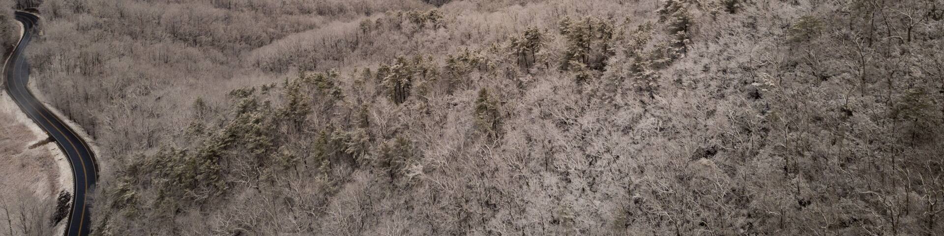 Aerial View of Winding North Carolina Mountain Road in the Snow