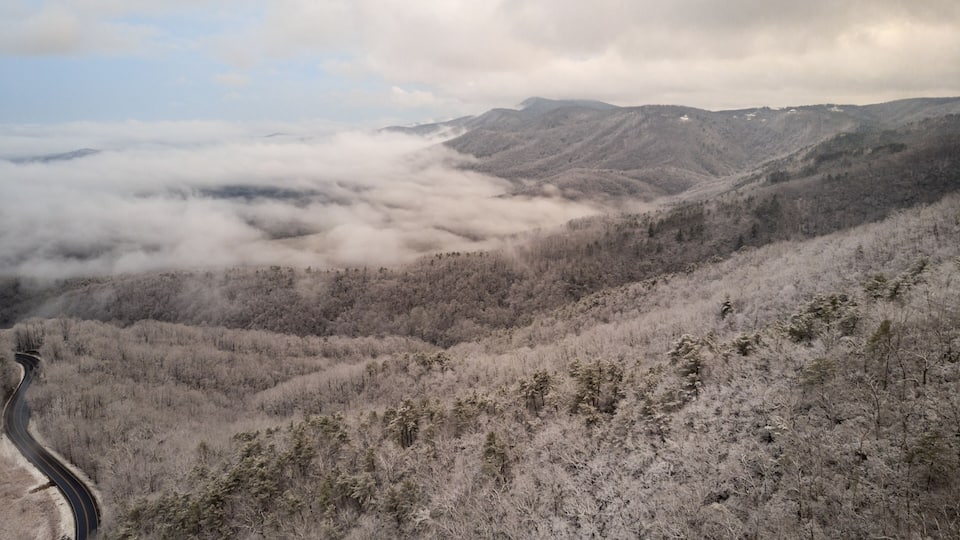 Aerial View of Winding North Carolina Mountain Road in the Snow