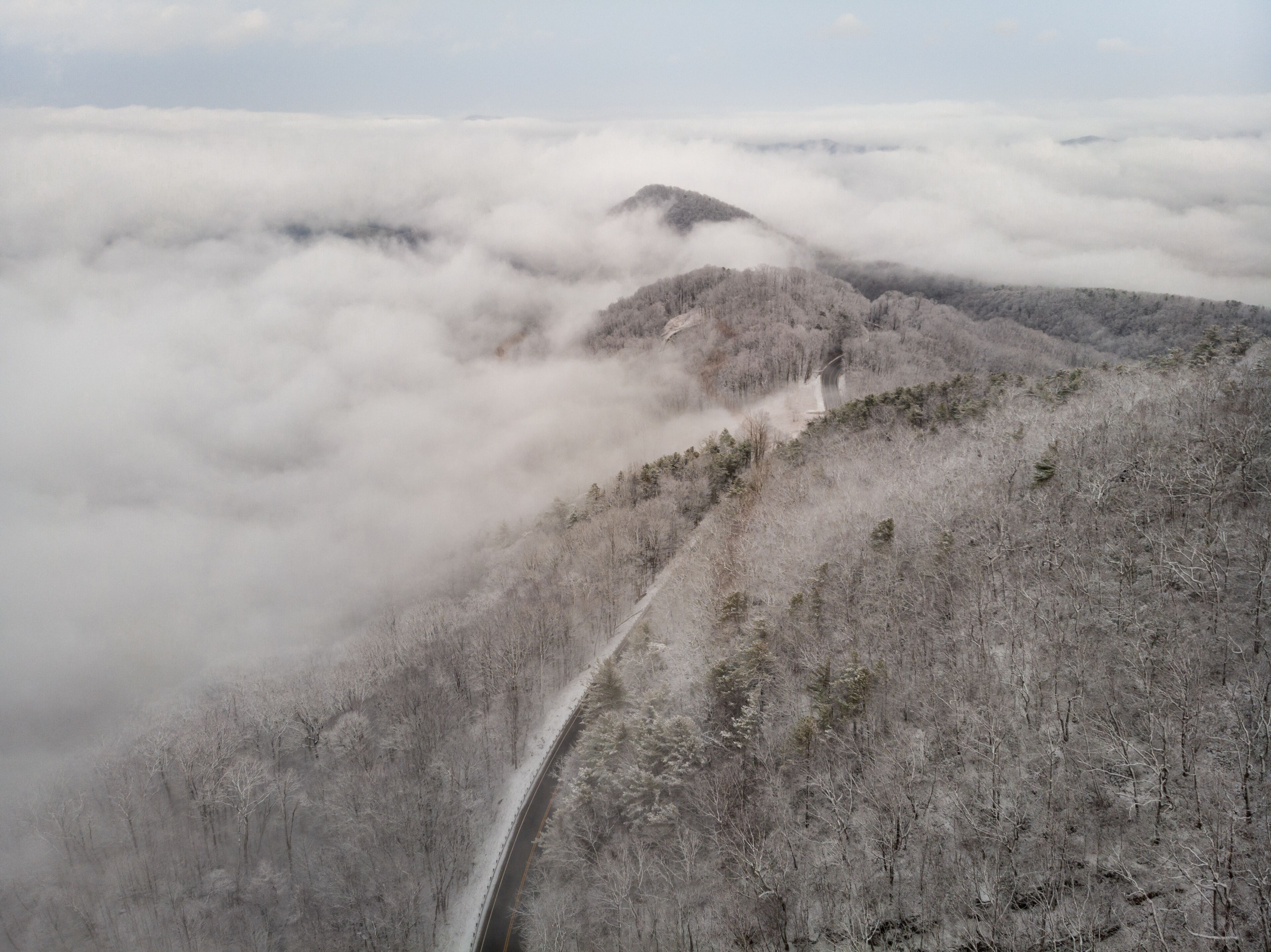 Aerial View of Winding North Carolina Mountain Road in the Snow