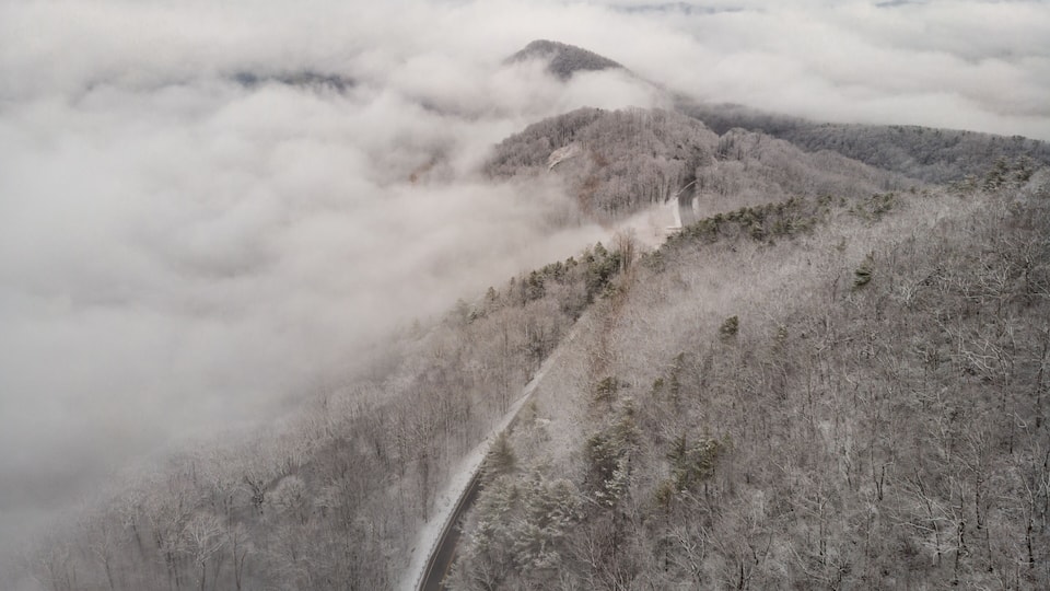 Aerial View of Winding North Carolina Mountain Road in the Snow