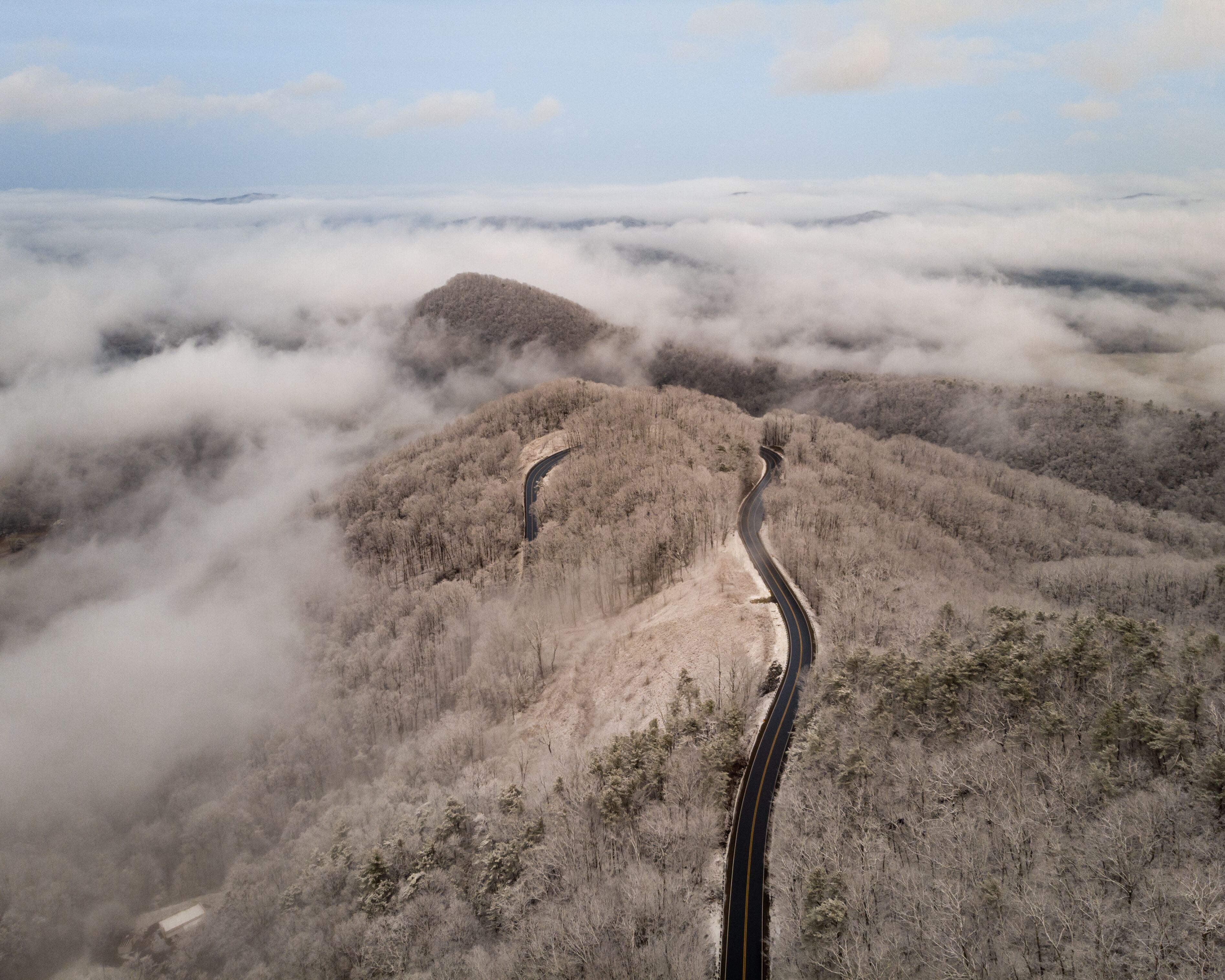 Aerial View of Winding North Carolina Mountain Road in the Snow