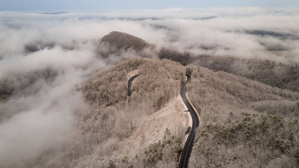 Aerial View of Winding North Carolina Mountain Road in the Snow