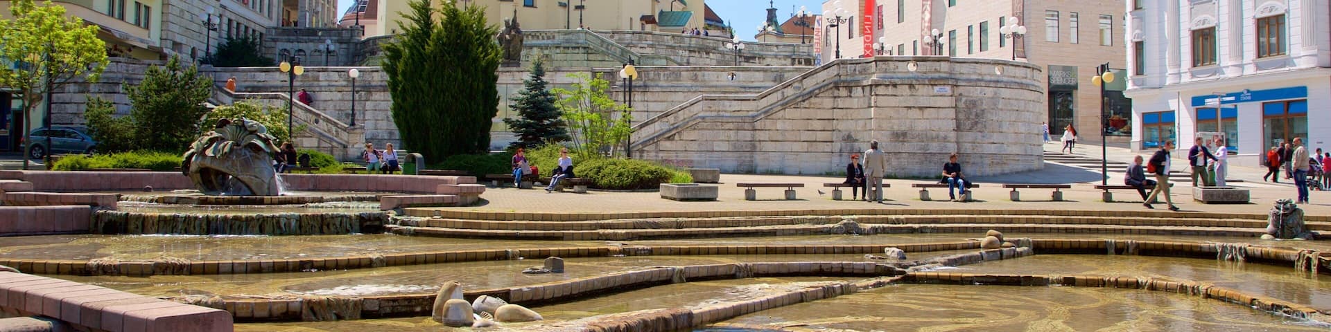 Zilina which includes a square or plaza, a city and a fountain