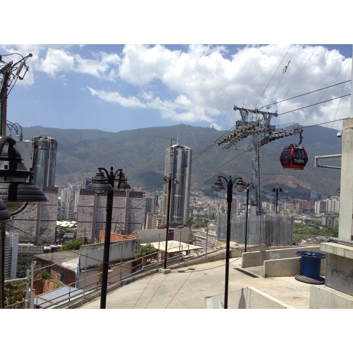 A cable car system with a mountainous backdrop.