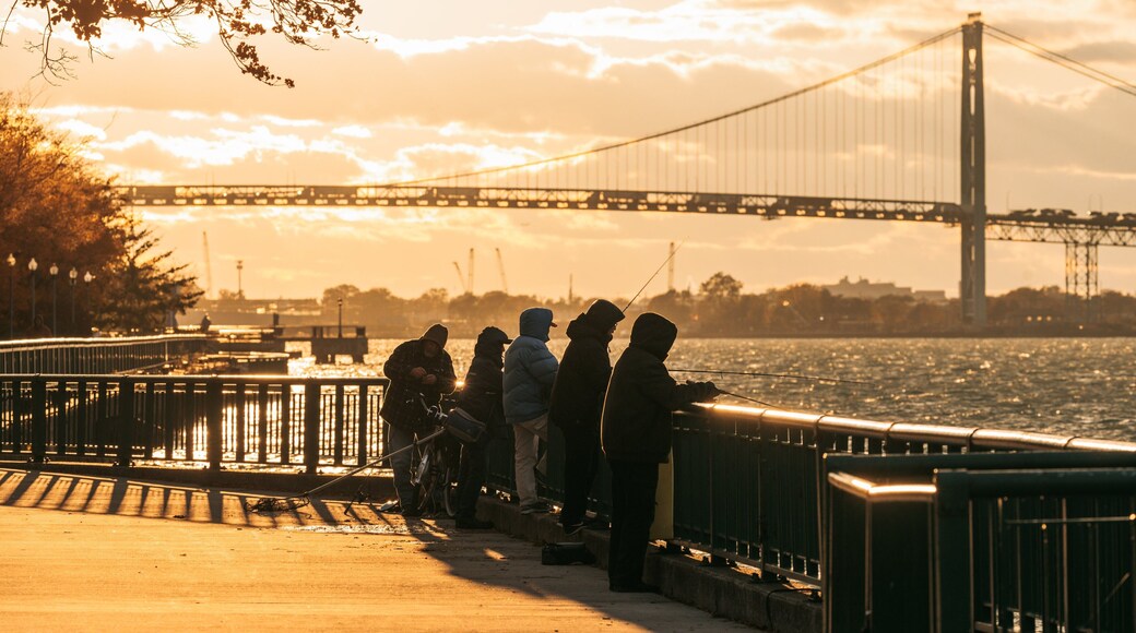 Windsor Riverfront showing a sunset, a river or creek and fishing