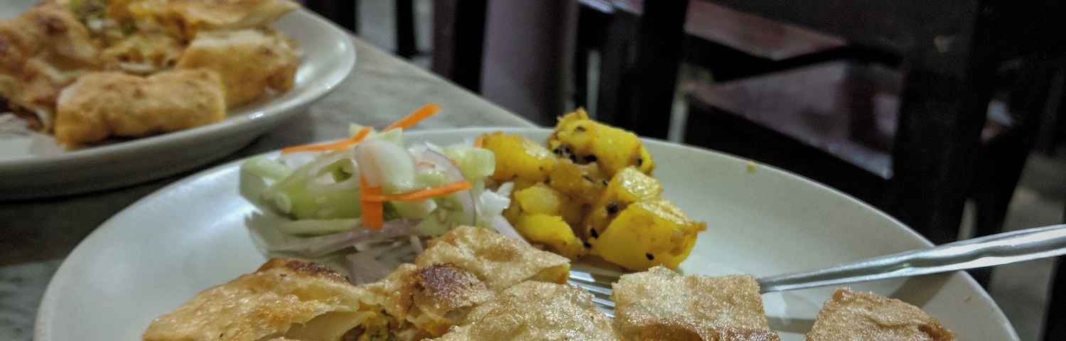 Cabins has been a long standing part of #Kolkata food culture. It not only provided seclusion to lovers to spend a while together curtained away from world, but also, in an era, when eating out in public was a taboo for women, they provided for private dining for women. And the fastest moving items in these cabins used to be Moghlai Paratha - paratha folded and fried with egg served with a dry potato curry and salad #GoodEats