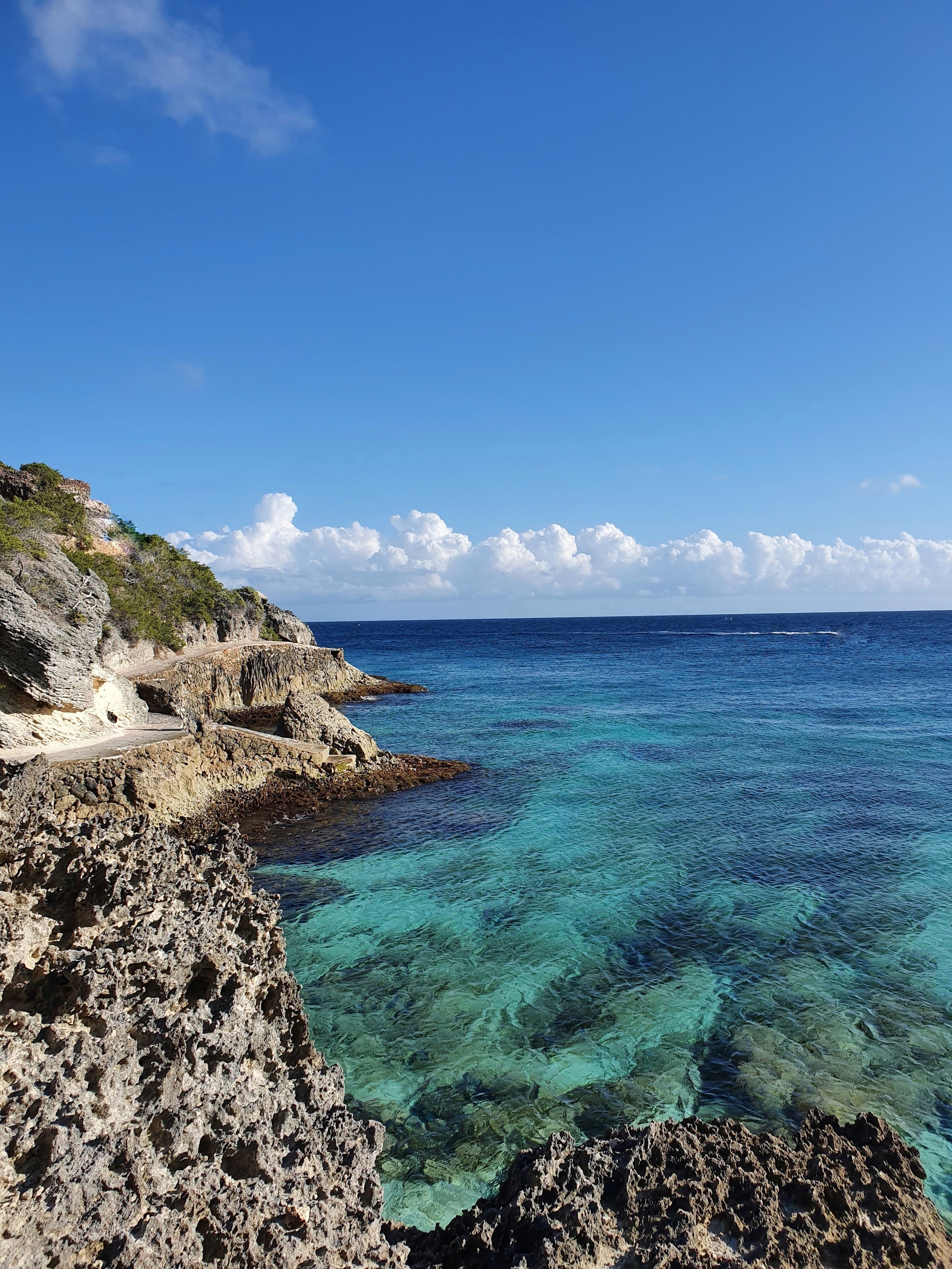South isla mujeres, below the Mayan temple of Ixchel, you can find  "secret" stairs that will take you to a rock road surrounding the south end of the island. If the sea is calm, like today, you can swim in crystal clear waters surrounded by small fish. #lifeAtExpediaGroup