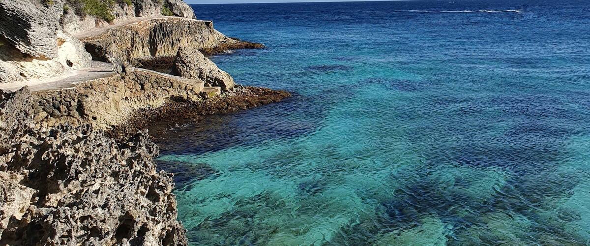 South isla mujeres, below the Mayan temple of Ixchel, you can find "secret" stairs that will take you to a rock road surrounding the south end of the island. If the sea is calm, like today, you can swim in crystal clear waters surrounded by small fish. #lifeAtExpediaGroup