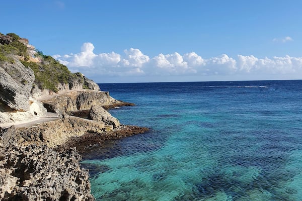 South isla mujeres, below the Mayan temple of Ixchel, you can find "secret" stairs that will take you to a rock road surrounding the south end of the island. If the sea is calm, like today, you can swim in crystal clear waters surrounded by small fish. #lifeAtExpediaGroup