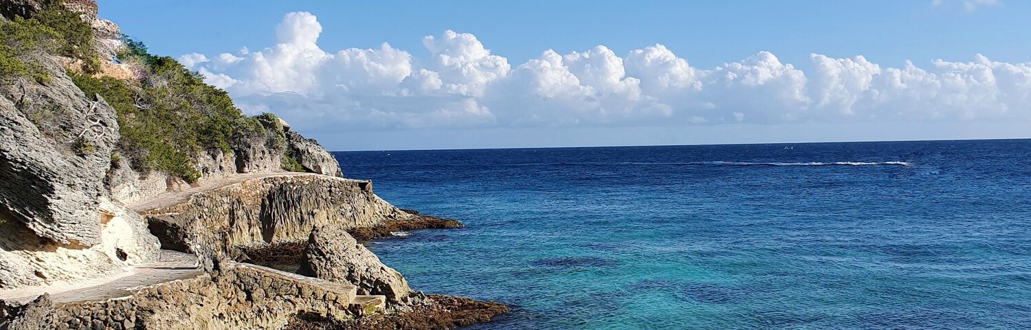 South isla mujeres, below the Mayan temple of Ixchel, you can find "secret" stairs that will take you to a rock road surrounding the south end of the island. If the sea is calm, like today, you can swim in crystal clear waters surrounded by small fish. #lifeAtExpediaGroup