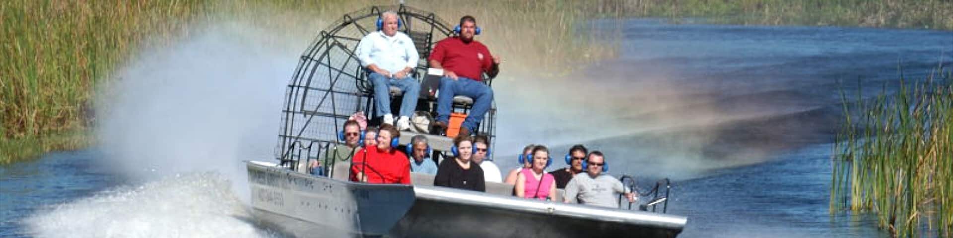 Exciting airboat ride through the lush wetlands of Kissimmee, Florida with a diverse group enjoying the adventure