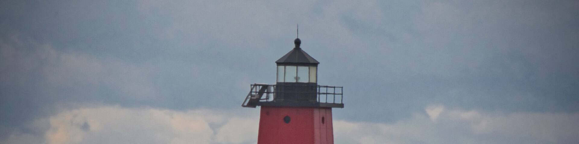 Manistique Lighthouse dealing with 8-12' waves from an angry Lake Michigan.