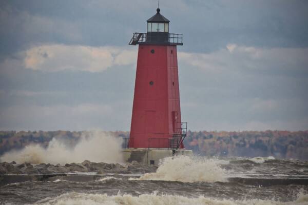 Manistique Lighthouse dealing with 8-12' waves from an angry Lake Michigan.