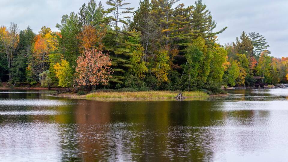 Waterfalls flowing into Lake of the Falls in Mercer, Wisconsin in September