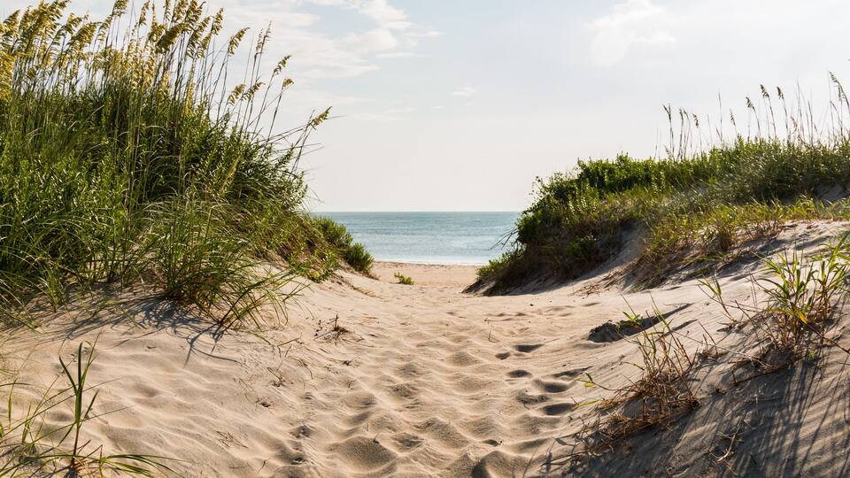 Sandy pathway to Coquina Beach on the Outer Banks in North Carolina at Cape Hatteras National Seashore.