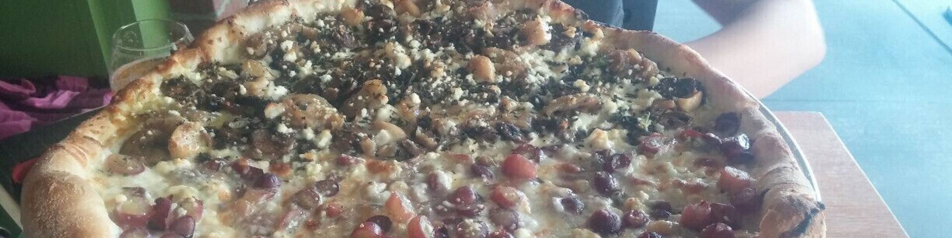 Half and Half! The back half includes roasted mushrooms, feta, caramelized onions, roasted & fresh garlic & herbs...and starring on the front half: Red grapes, gorgonzola & fresh rosemary.
