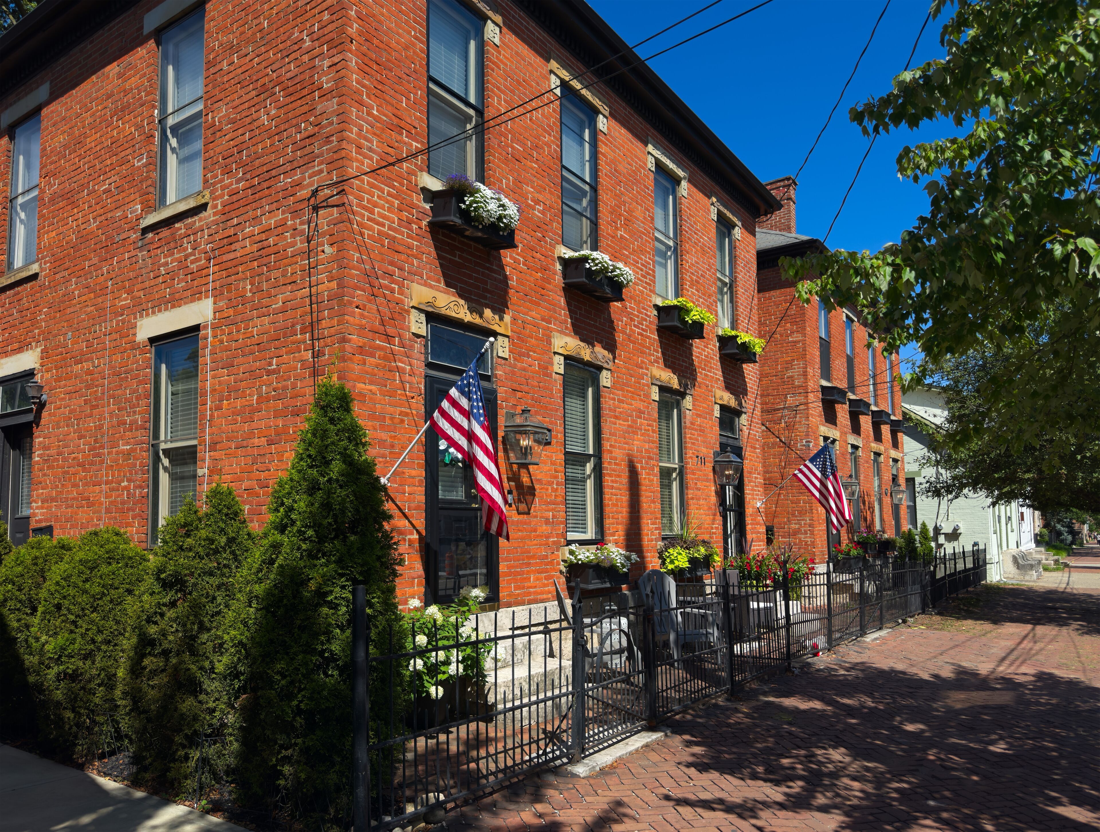 Old residential buildings along brick sidewalks maintain an old world charm in German Village, a uniquely preserved neighborhood of Columbus, Ohio
