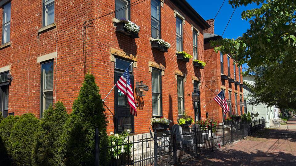Old residential buildings along brick sidewalks maintain an old world charm in German Village, a uniquely preserved neighborhood of Columbus, Ohio