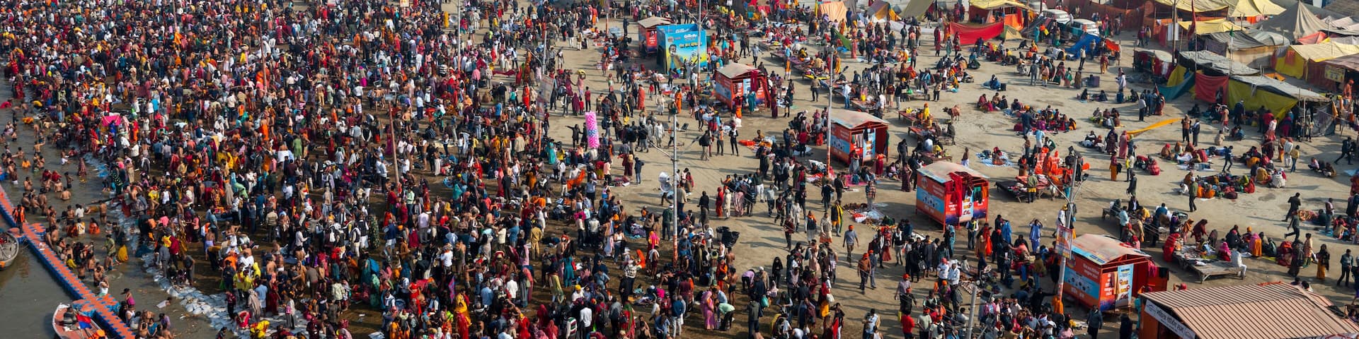 Prayagraj,India-28 pJanuary 2025 Top angle view of the crowd bathing at Sangam on the banks of Ganga at the Kumbh Mela in Prayagraj or Allahabad Uttar Pradesh India