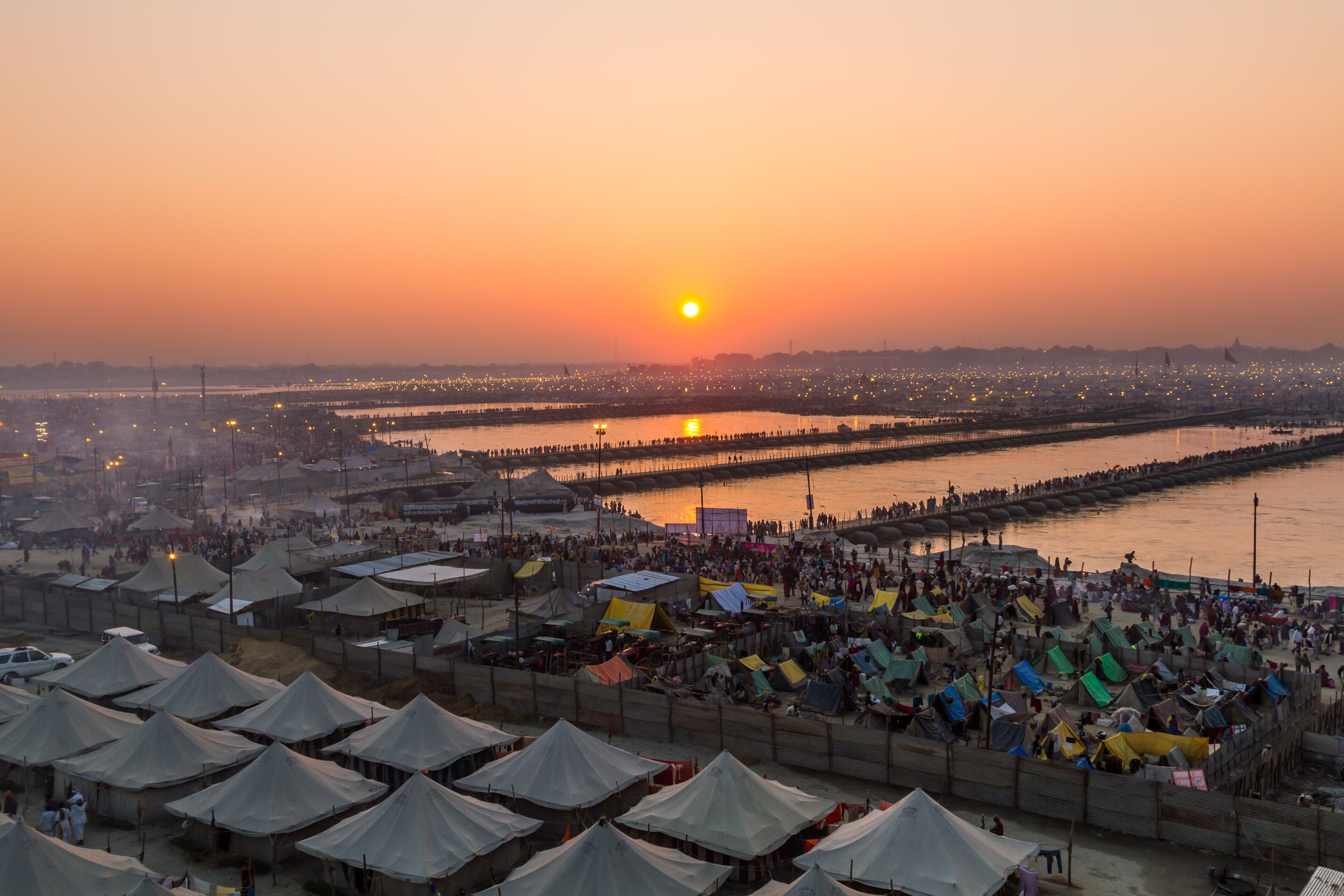 Hindu pilgrims cross pontoon bridges into the massive campsite during the festival of Kumbha Mela on February 10th 2013 at Allahabad, India.
