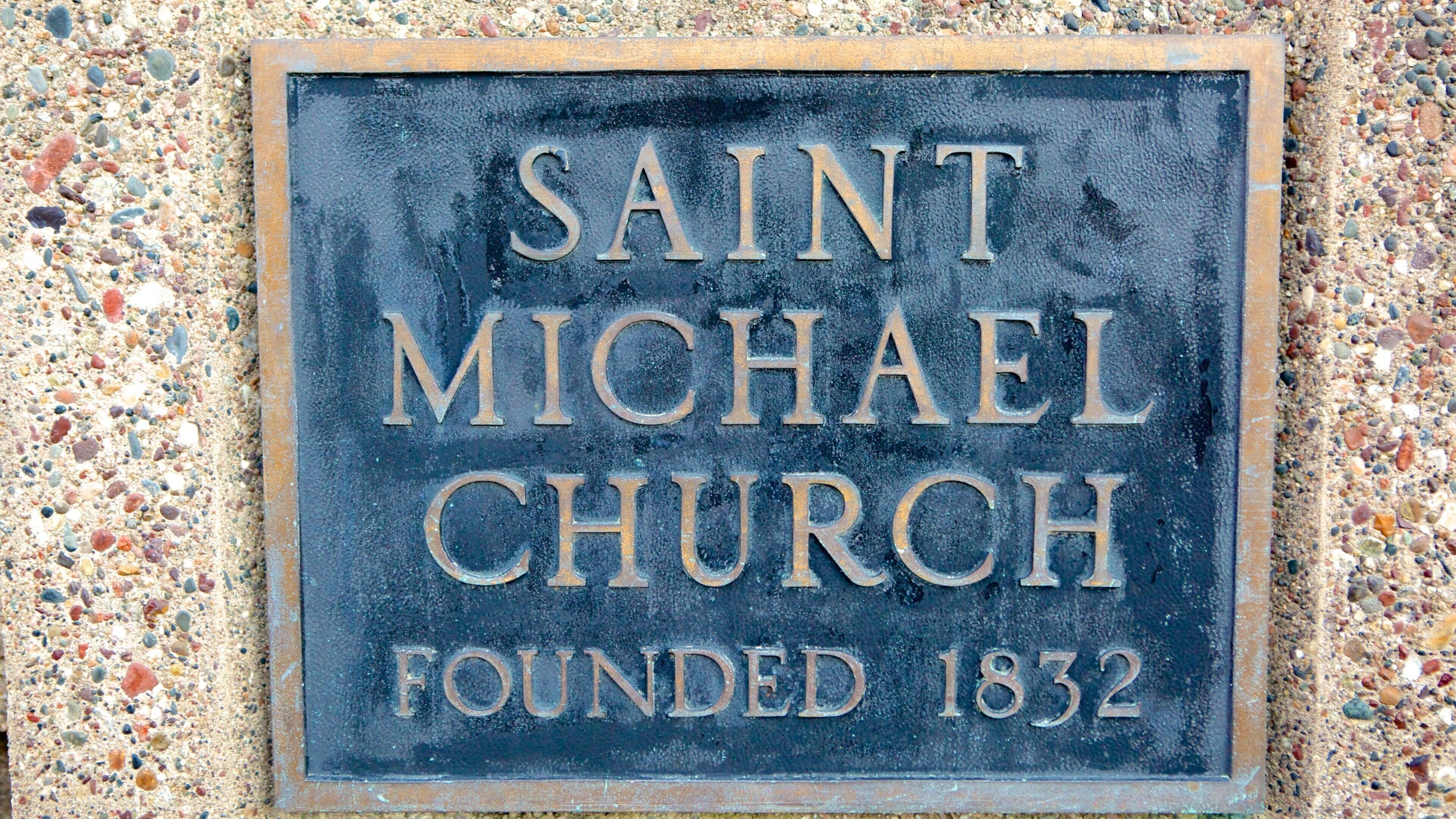 A sign for Saint Michael Church, founded in 1832.