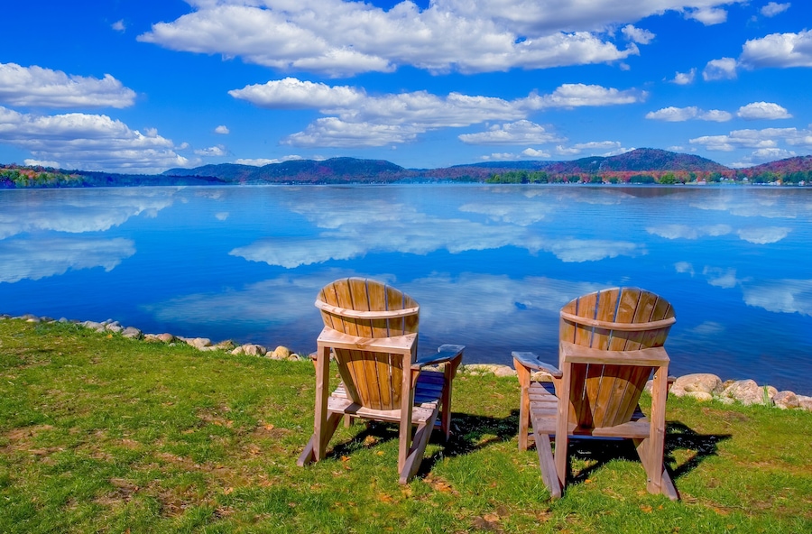 Two chairs on Fourth Lake ( Fulton Chain Lakes ) in the Adirondack Mounations of New York State