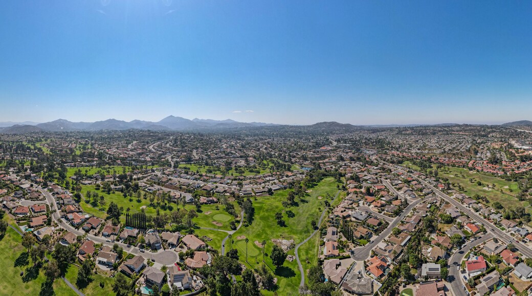 Aerial view of residential neighborhood surrounded by golf and valley during sunny day in Rancho Bernardo, San Diego County, California. USA.
