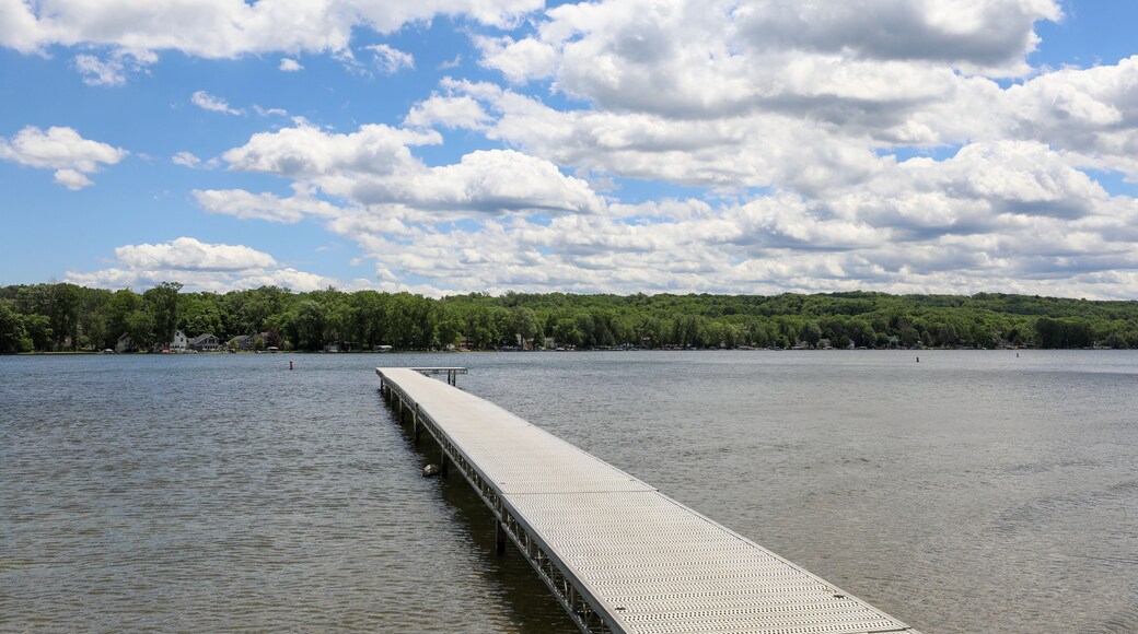 View of Conesus lake and boat dock at Long Point beach park. Geneseo, New York.