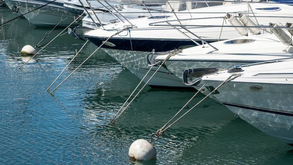 reflections of masts and boats at the geneva yacht club